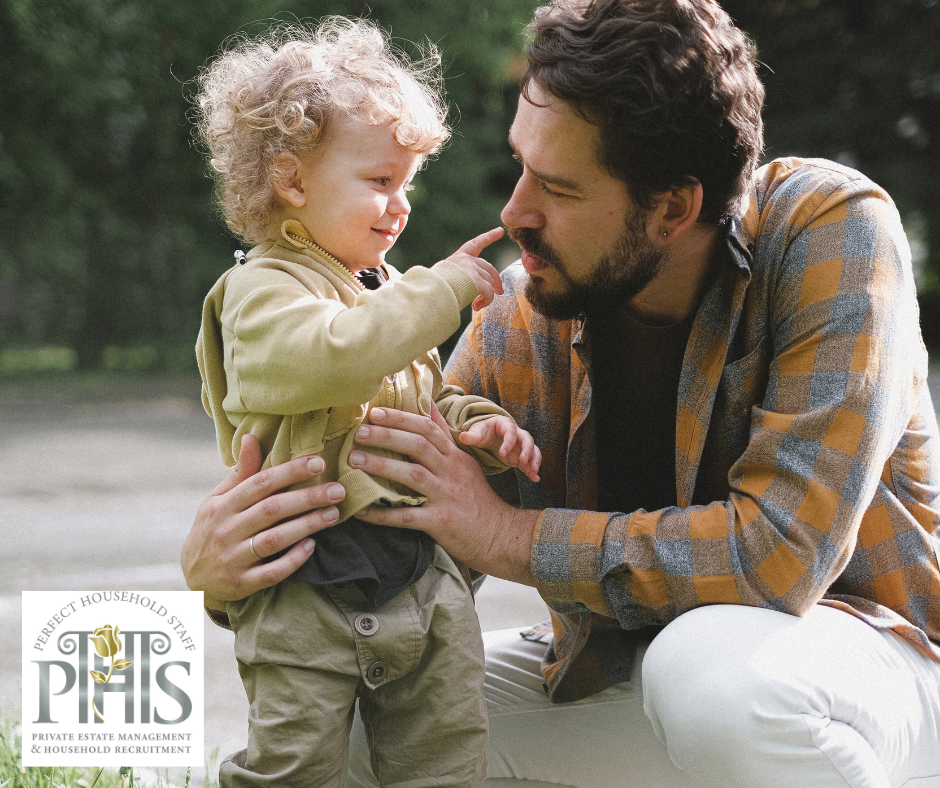 Professional manny playing outdoors with children – trusted childcare recruitment